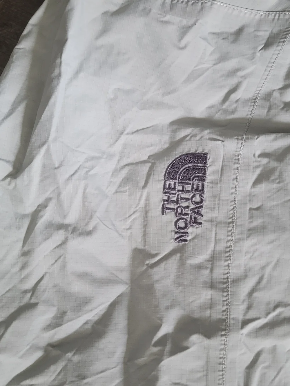 The North Face Light Gray Hooded Rain Jacket with Dark Gray Panels